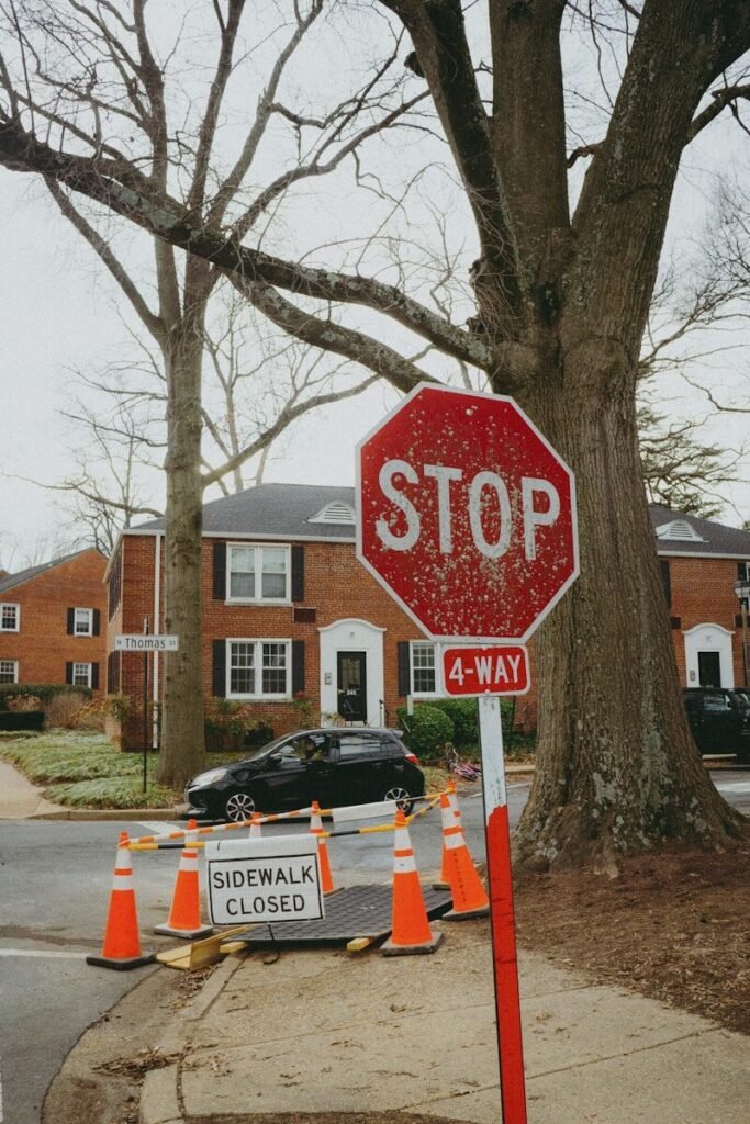 A red stop sign sitting on the side of a road